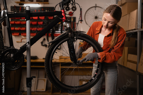 Repair technician bicycles was repaired and make technical expertise in bicycle shop. Bicycle mechanic repairs bike in workshop photo