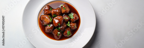 Elegant stoofvlees plated with rich sauce on white dish, gourmet presentation photo