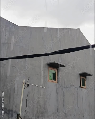 raindrops falling from the roof of the house