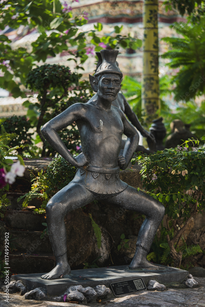 Statue in the temple garden at Bangkok, Thailand Statue in the temple garden at Bangkok, Thailand