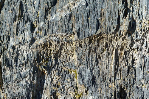 Beautiful natural texture of stones Caucasus mountains in Dombay. Schist rock and its schistosity (cleavage) for original texture background. Nature concept for design photo