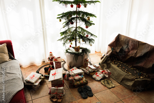 Eco-Friendly Gift Wrapped in Newspaper Under Christmas Tree