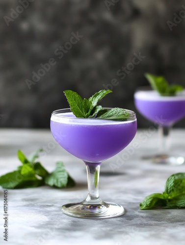 Refreshing Blueberry Mint Lime Cocktails - Cool, vibrant purple cocktails.  Blueberry and mint flavors combine for a refreshing summer drink.  Garnished with lime.  Perfect for parties or relaxation.  photo