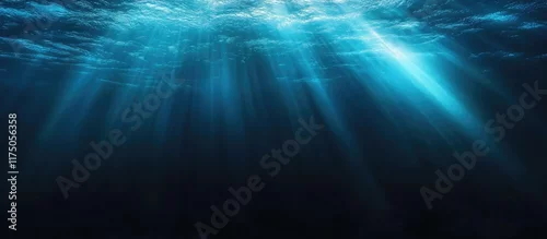 Panel kuchenny z motywem Mysterious dark underwater background with vibrant rays of light creating an ethereal atmosphere perfect for overlaying text or graphics.