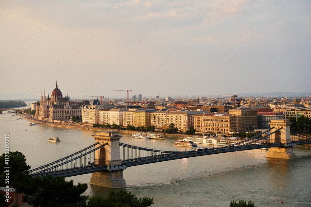 Obraz premium Panoramic view on Budapest cityscape with Chain Bridge and Hungarian Parliament along Danube River. Architecture of capital of Hungary with historical buildings and famous landmarks