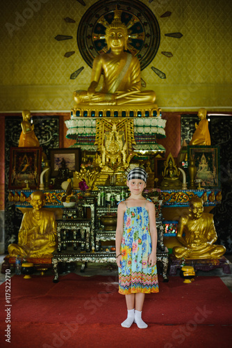 Portrait of a little girl in Asia in Thailand in the temple photo