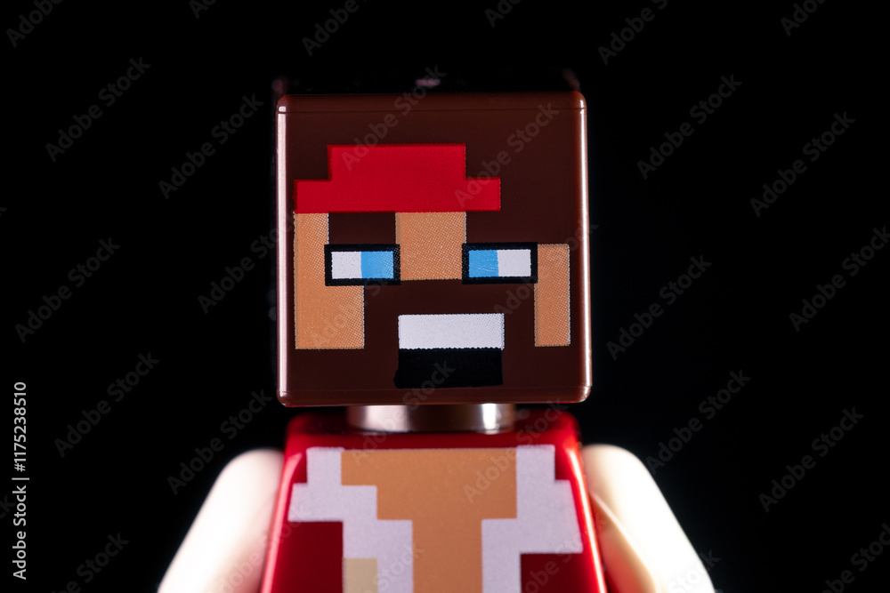 Naklejka premium Face closeup of LEGO Minecraft man pirate on the black background