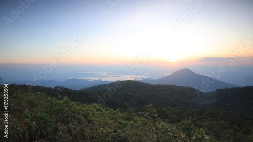 Beautiful landscape of green mountains   with sunset sky.