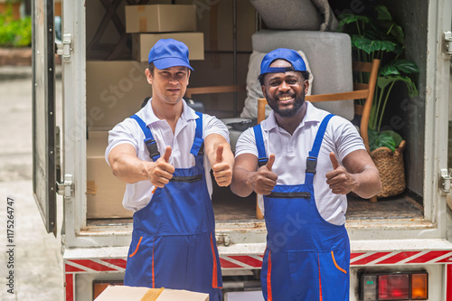 Obraz na płótnie Happy service team of delivery worker working load customer boxes from truck and makes inventory of packed boxes and writes data to clipboard with smile confident and professional service w salonie