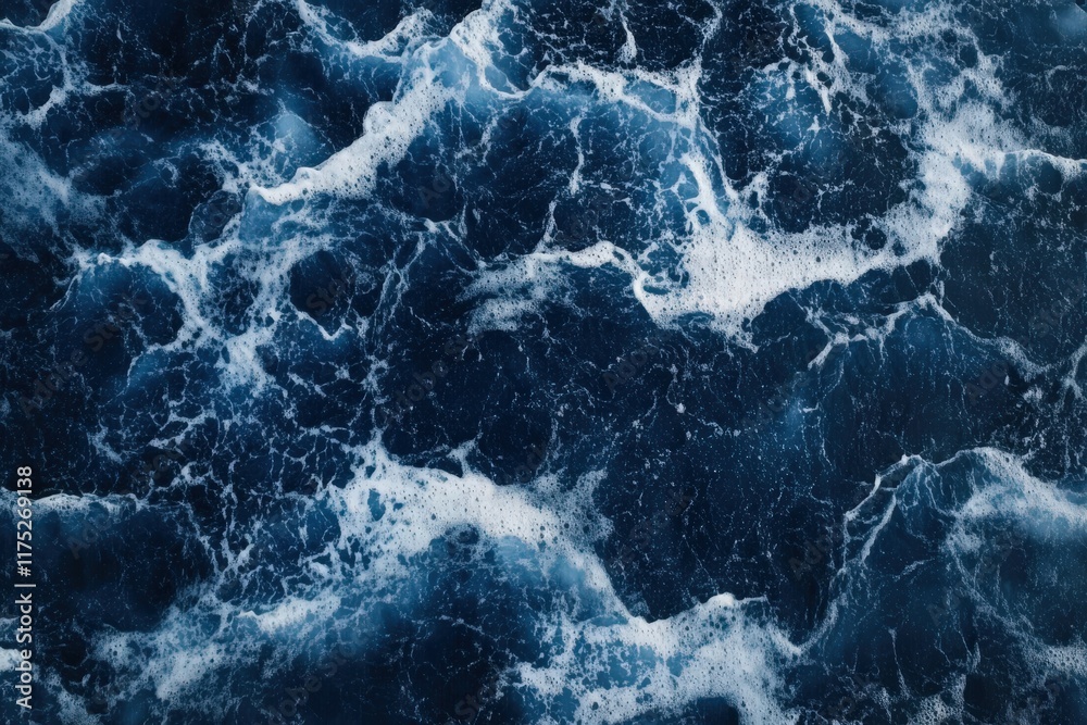 Fototapeta premium Waves crashing in an expansive ocean landscape under midday light