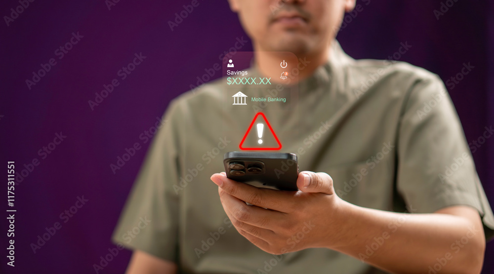A man holding a smartphone with a alert sign indicating a warning related to mobile banking. online banking risks, cybersecurity issues, and financial technology awareness.