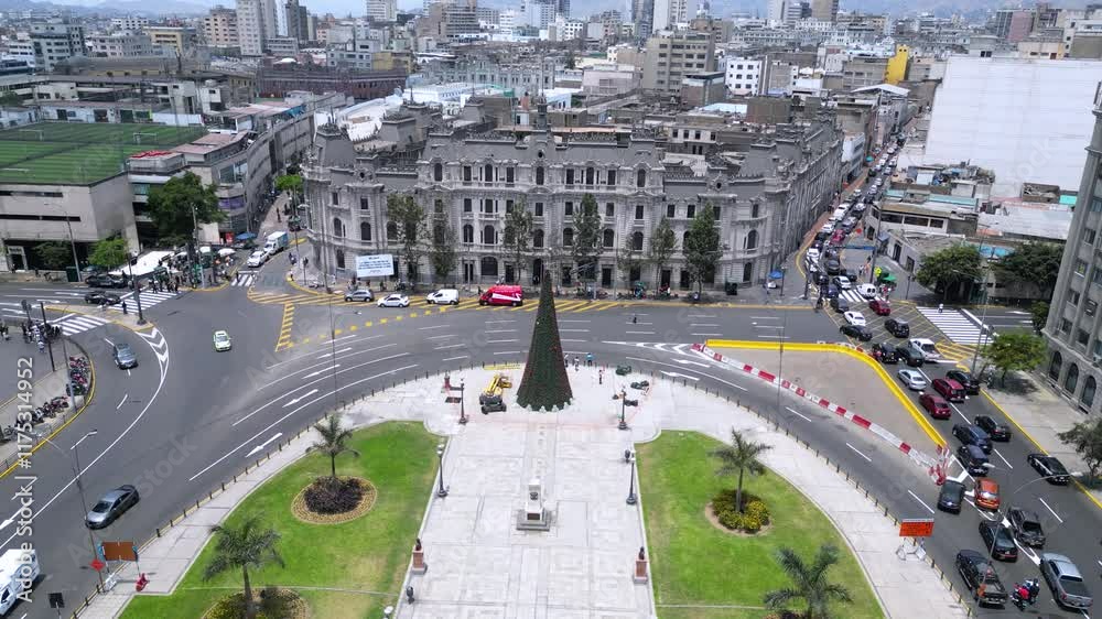 Drone capture of a vibrant urban square on a sunny summer day, showcasing the city’s architecture and green spaces, Lima, Peru.