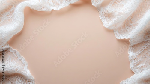 Delicate white lace fabric arranged on a soft peach background.  Perfect for wedding invitations or romantic projects.
