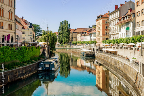Streets in the center of Ljubljana, capital of Slovenia. Reflection of city streets in the Ljubljanica River.