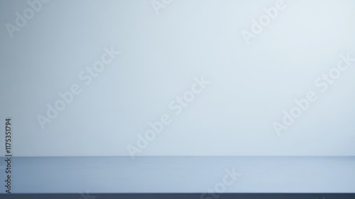 Simple, minimalist studio background with a light blue wall and tabletop.