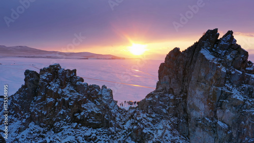 Shaman rock in frozen lake Baikal photo