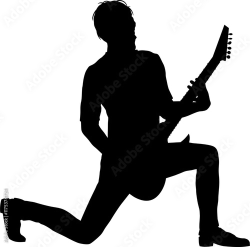 Une silhouette d'un musicien qui joue de la guitare