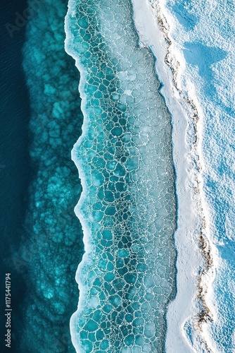 Stunning aerial view showcases icy shoreline blending with turqu photo