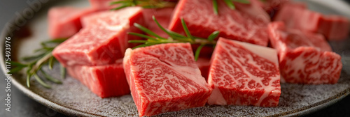 Thick, marbled slices of luxurious Wagyu beef are displayed on a plate, garnished with fresh rosemary sprigs, highlighting high-end culinary art and gourmet taste. photo