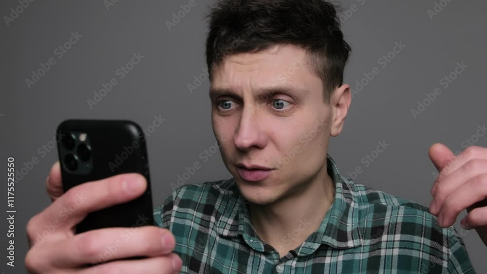 Shocked guy man shock wonder reading news in phone social media amazed with smartphone message surprised. Shocked guy man shock wonder reading news in phone social media amazed with smartphone message surprised.