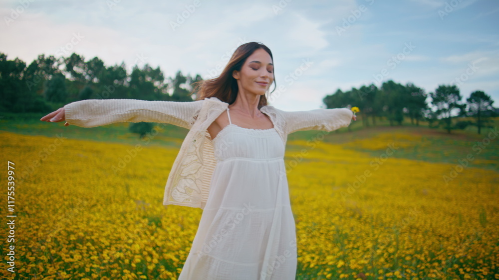 Serene woman walking field spreading arms closeup. Lady stepping wildflowers Serene woman walking field spreading arms closeup. Lady stepping wildflowers