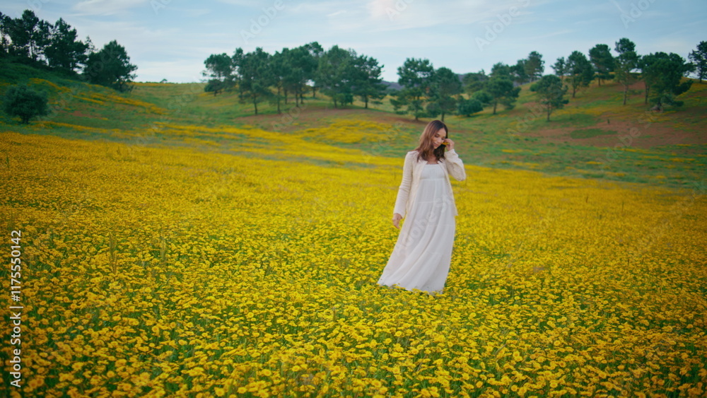 Pretty woman relaxing flowers field cloudy summer day. Carefree girl strolling Pretty woman relaxing flowers field cloudy summer day. Carefree girl strolling