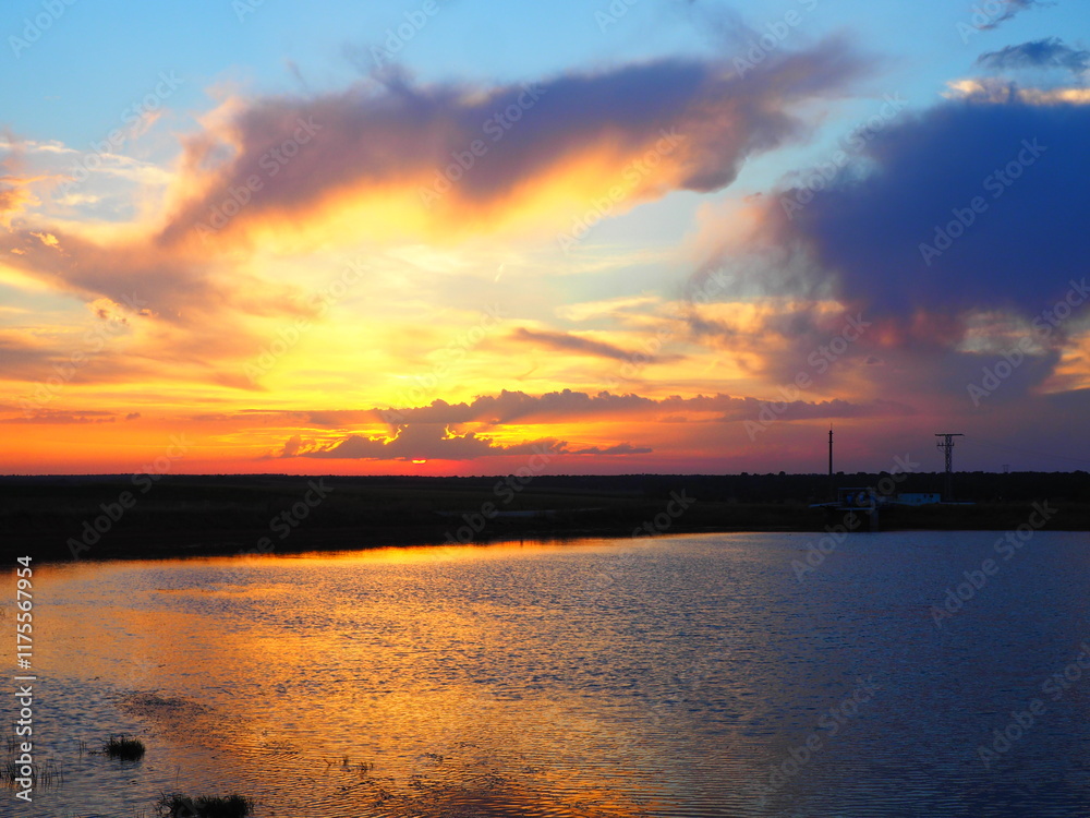 Reddish summer sunset over a lake in northern Spain Reddish summer sunset over a lake in northern Spain
