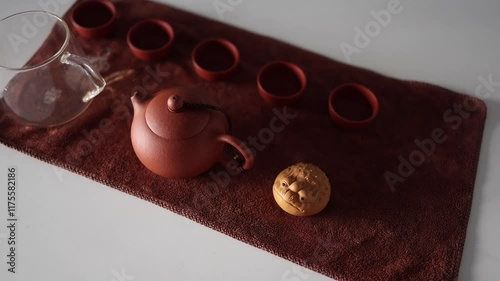 tea ceremony made of yasin clay and a figurine on the table photo