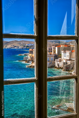 Vaporia neoclassical district of Ermoupolis town in the island of Syros, Cyclades, Greece, through a window