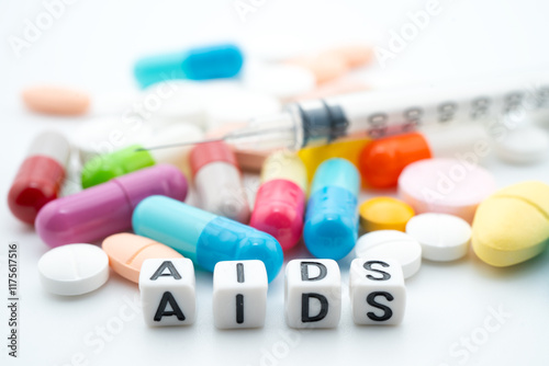 AIDS Acquired immunodeficiency syndrome word with pills and capsules medical drug. photo