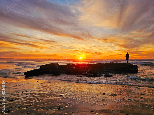 Beautiful sunset at Praia Vale Figueiras in Portugal photo