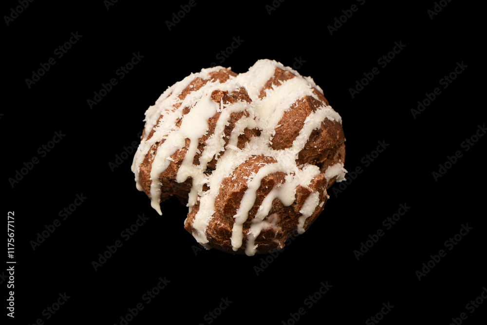 Profiteroles with coconut cream on a black background. Profiteroles with coconut cream on a black background.