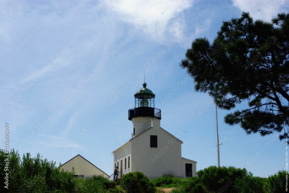 Historic lighthouse against a clear blue sky Historic lighthouse against a clear blue sky