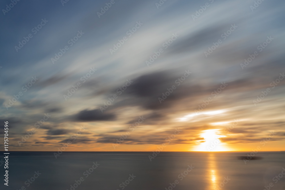 Naklejka premium A long exposure of a spectacular sunrise in Punta Cana, Dominican Republic