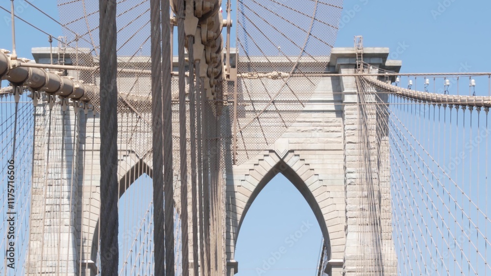 Obraz premium Brooklyn Bridge to Manhattan downtown, cables and blue sky. New York City iconic symbol, USA travel destination. Architecture of United States of America, tourist landmark. Famous cable-stayed bridge.