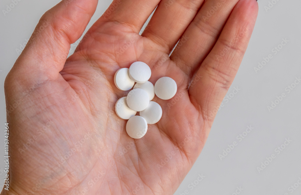 Woman hand holding pills or tablets. Concept of medicals, drug store, pharmacy, healthcare and medicine. Woman hand holding pills or tablets. Concept of medicals, drug store, pharmacy, healthcare and medicine.