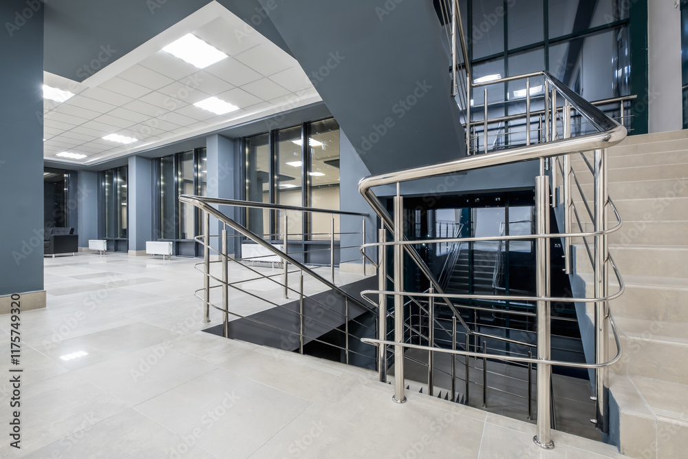 Fototapeta premium stairs emergency and evacuation exit stair in up ladder in a new office building at night