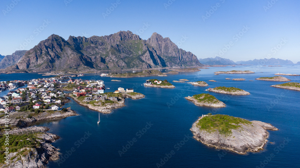 Obraz premium Aerial view of Henningsvaer typical norwegian village on a fjordn with in a summer day