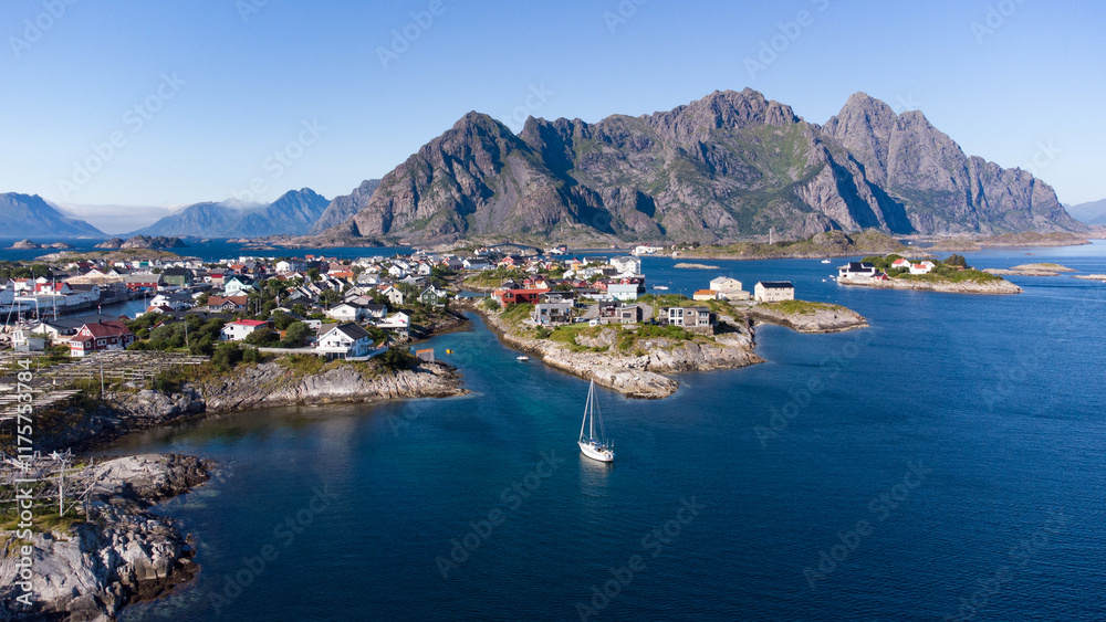 Fototapeta premium Aerial view of Henningsvaer typical norwegian village on a fjordn with in a summer day