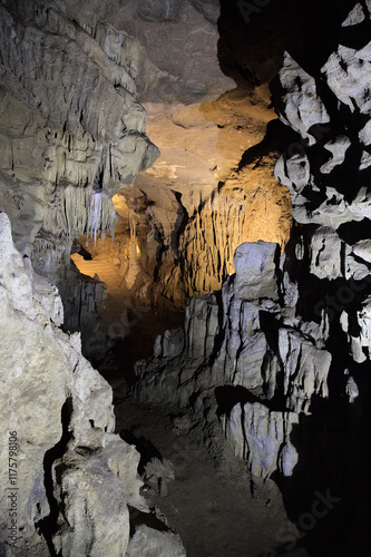 Rock formations of Betharram caves in France during a serene midday excursion photo