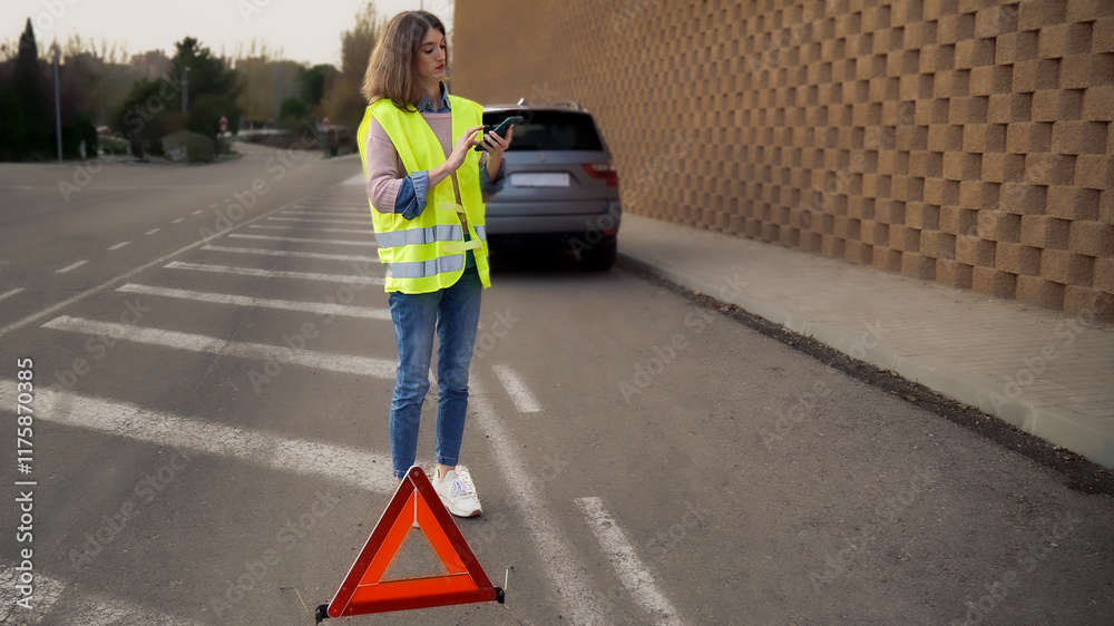 Young woman requesting help on mobile phone after car breakdown