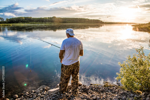 Man fisherman with fishing rod fishing in river fishing, lake waterscape photo