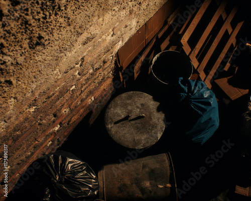 Obraz na płótnie All kinds of rubbish lying on the street near a wall. A polluted urban environment. 3D render. w salonie
