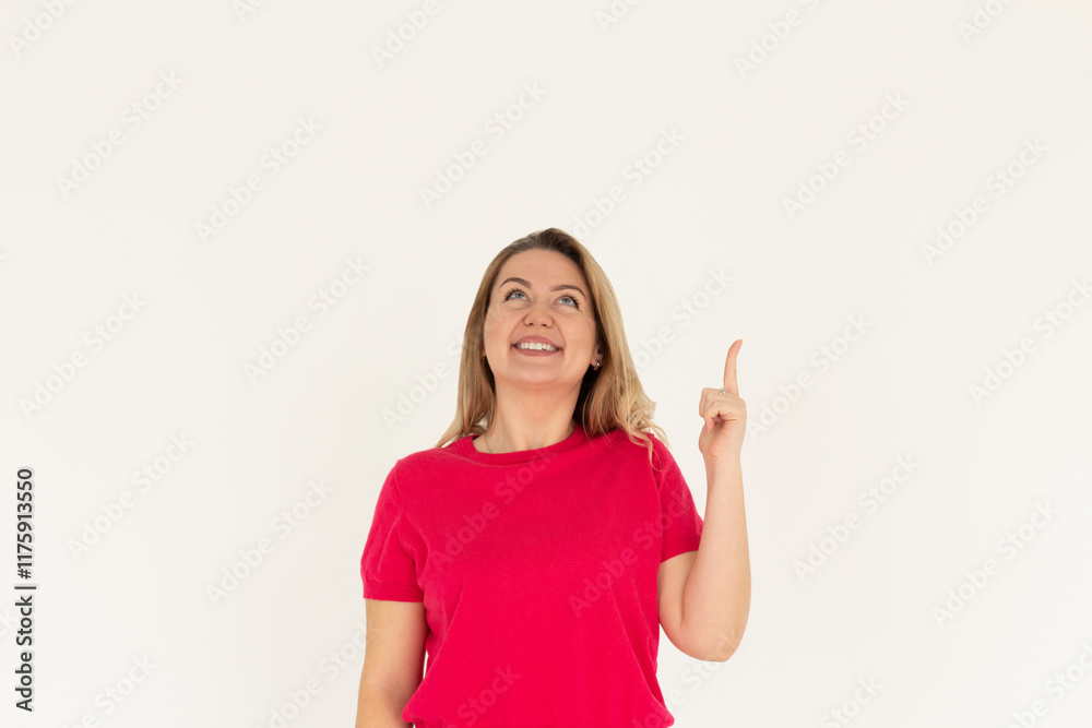 Smiling woman pointing finger up over white background Smiling woman pointing finger up over white background