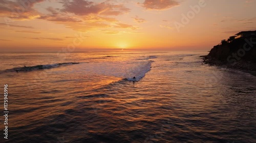 Riding the Waves: Aerial Shot of Surfing at Golden Sunset in San Diego, California