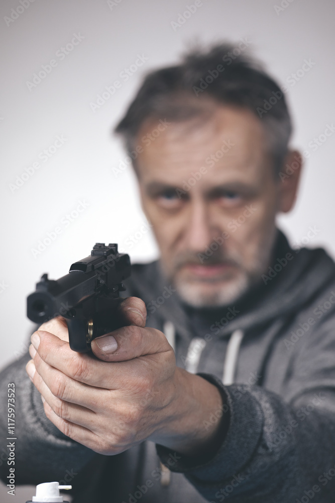 Man take care of small caliber semi automatic sporting gun .22 LR Man take care of small caliber semi automatic sporting gun .22 LR