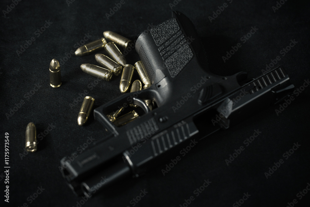 Unloaded semi automatic pistol handgun at home with munition Unloaded semi automatic pistol handgun at home with munition