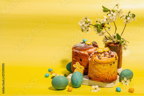 Easter cake Cruffin or sweet bread kulich. Traditional festive baking and blooming cherry branches photo