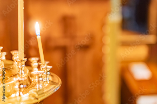 Close-up of a lit menorah with multiple arms in a warmly-lit interior setting photo