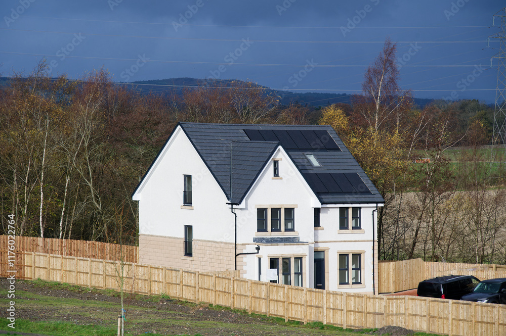 Solar panels installed on home roofs at new housing development Solar panels installed on home roofs at new housing development